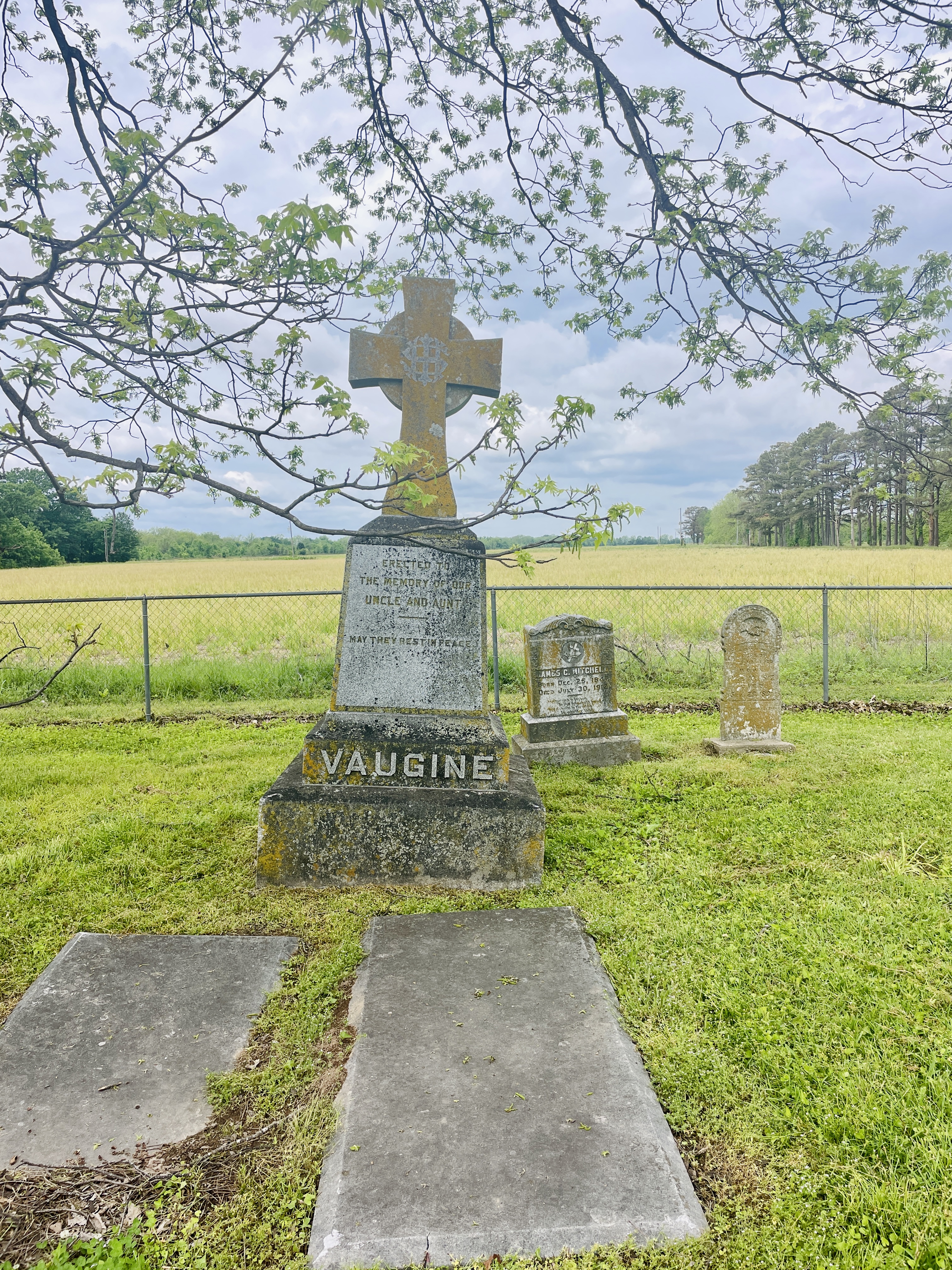 Headstones of French-speaking families in Old St. Mary’s Cemetery beside historic Catholic church in Plum Bayou, Arkansas